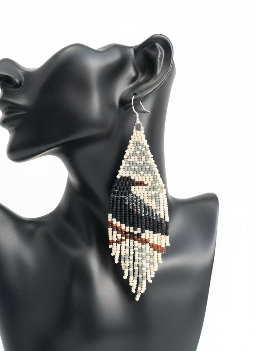 Beaded Black Raven on tree branch on gray  beige background