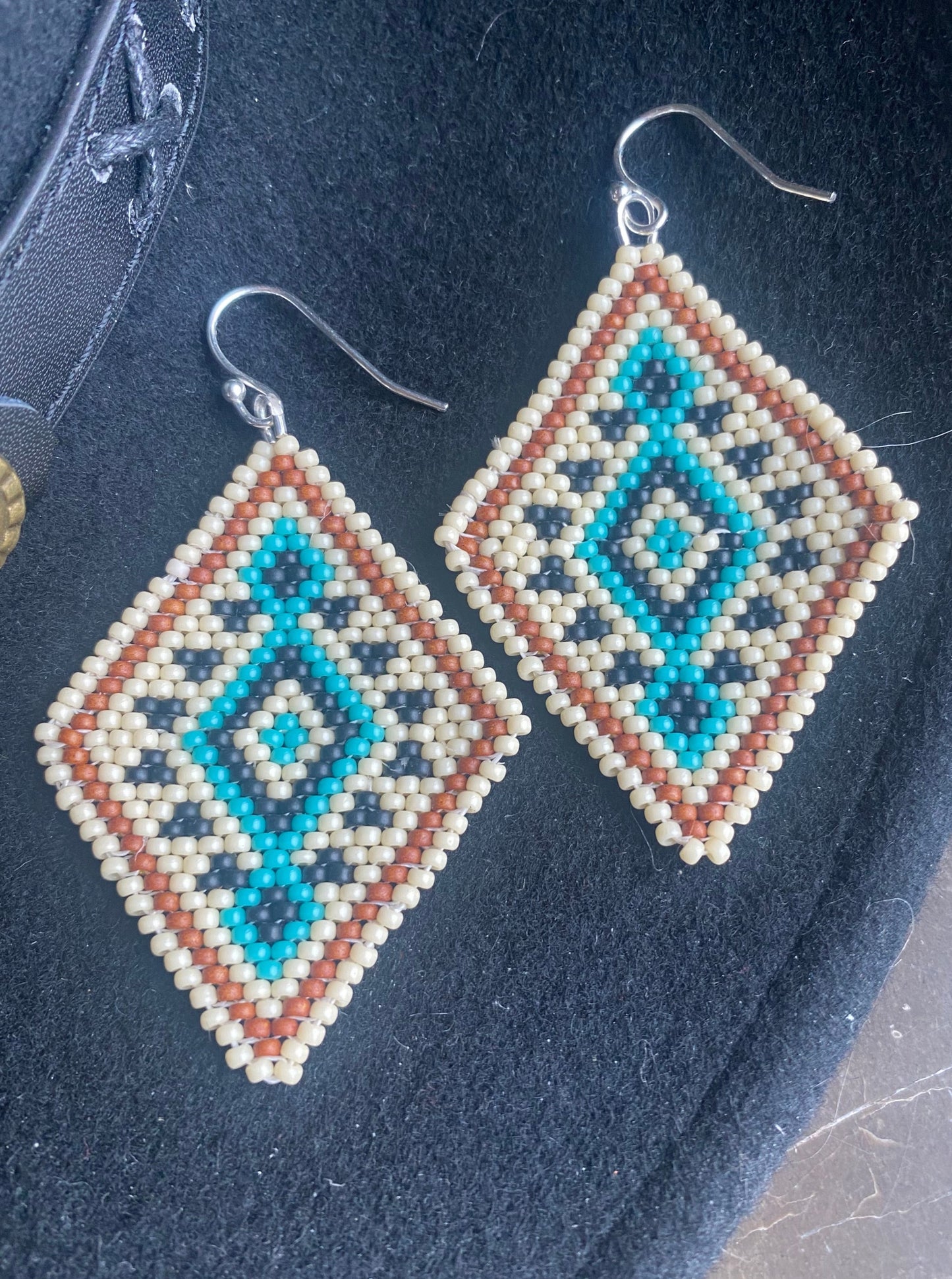 Badlands beadwork turquoise and cream beaded earrings