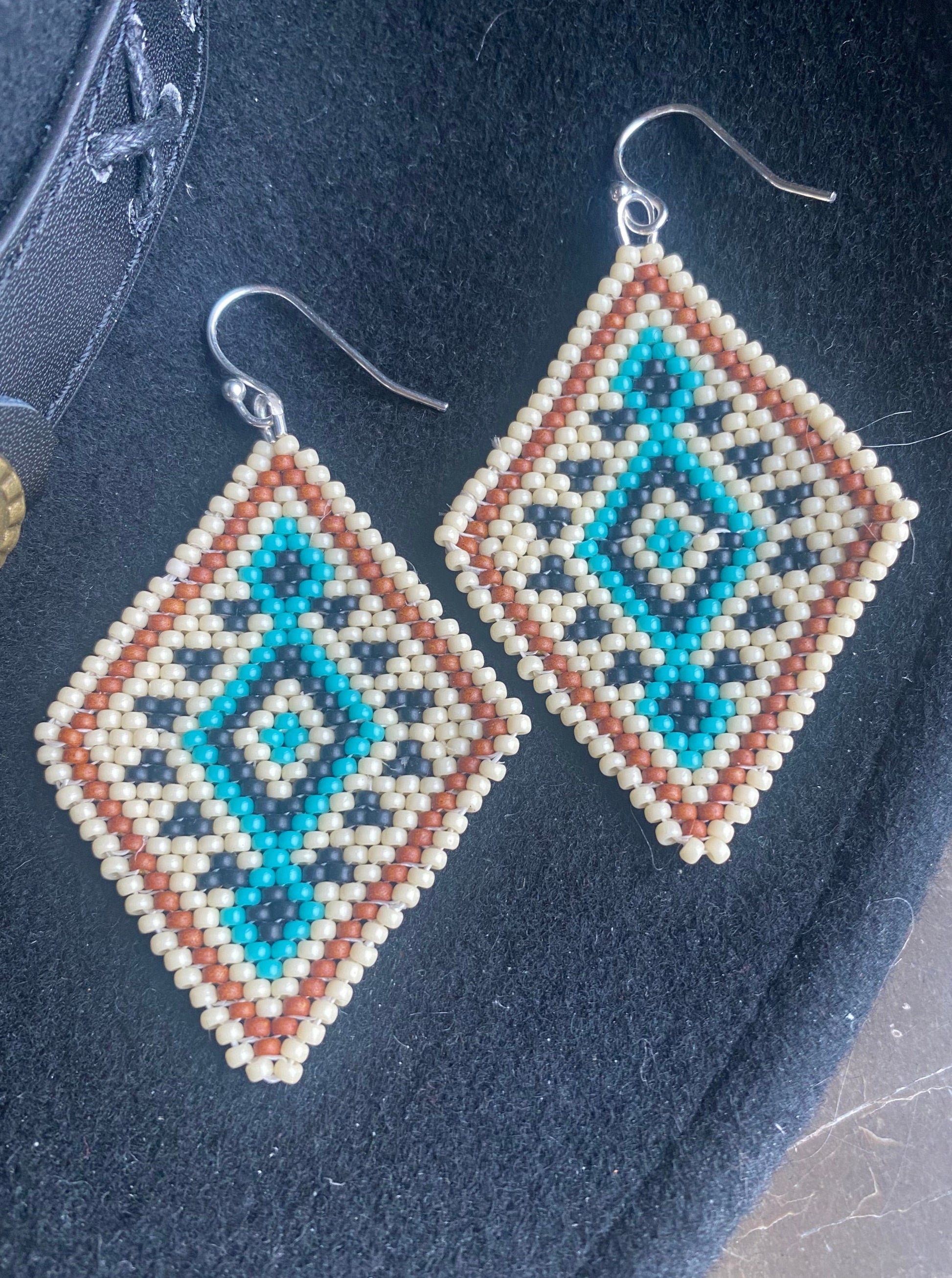 Badlands beadwork turquoise and cream beaded earrings